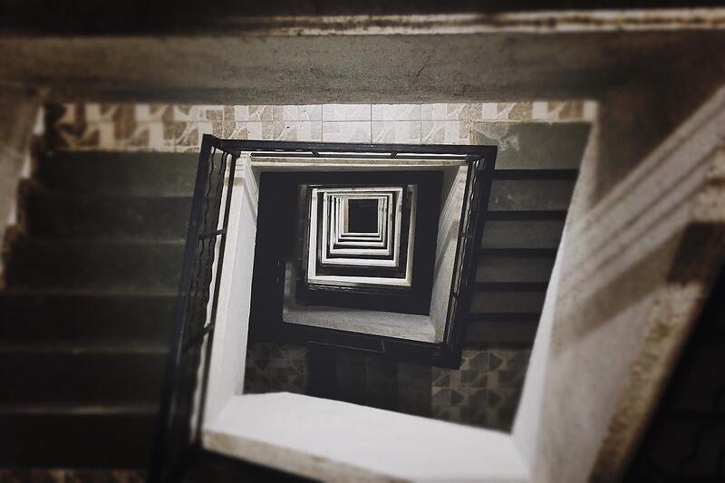 An interior stairwell of an apartment building, the route most student move-outs take