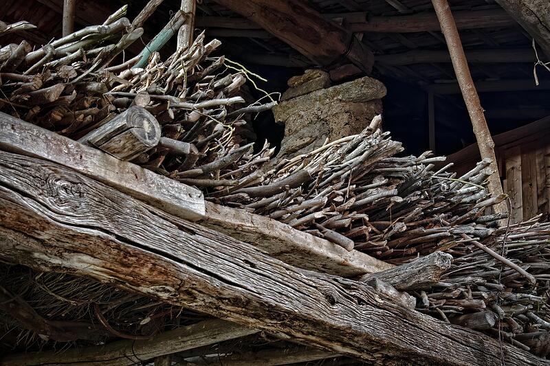 The inside of a storage shed crowded with old equipment