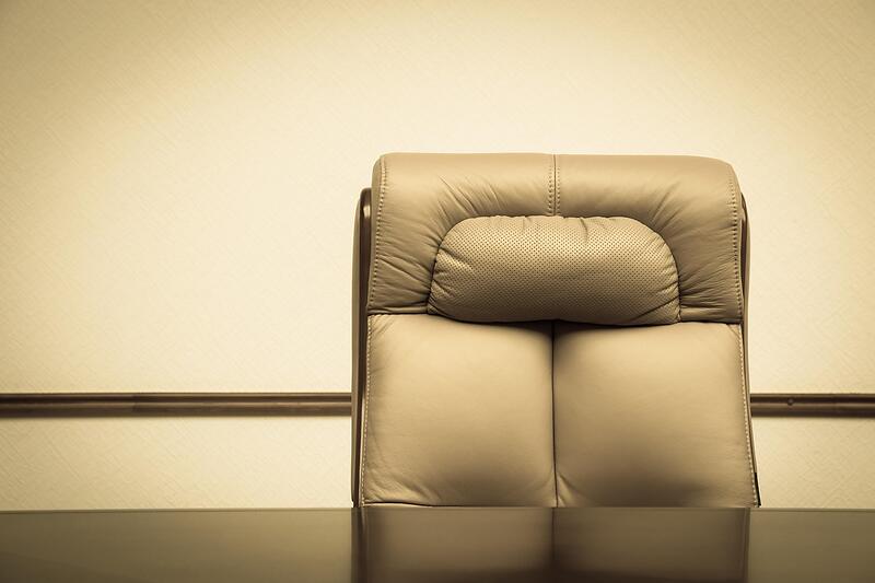 Office chairs and furniture gathered at a loading dock